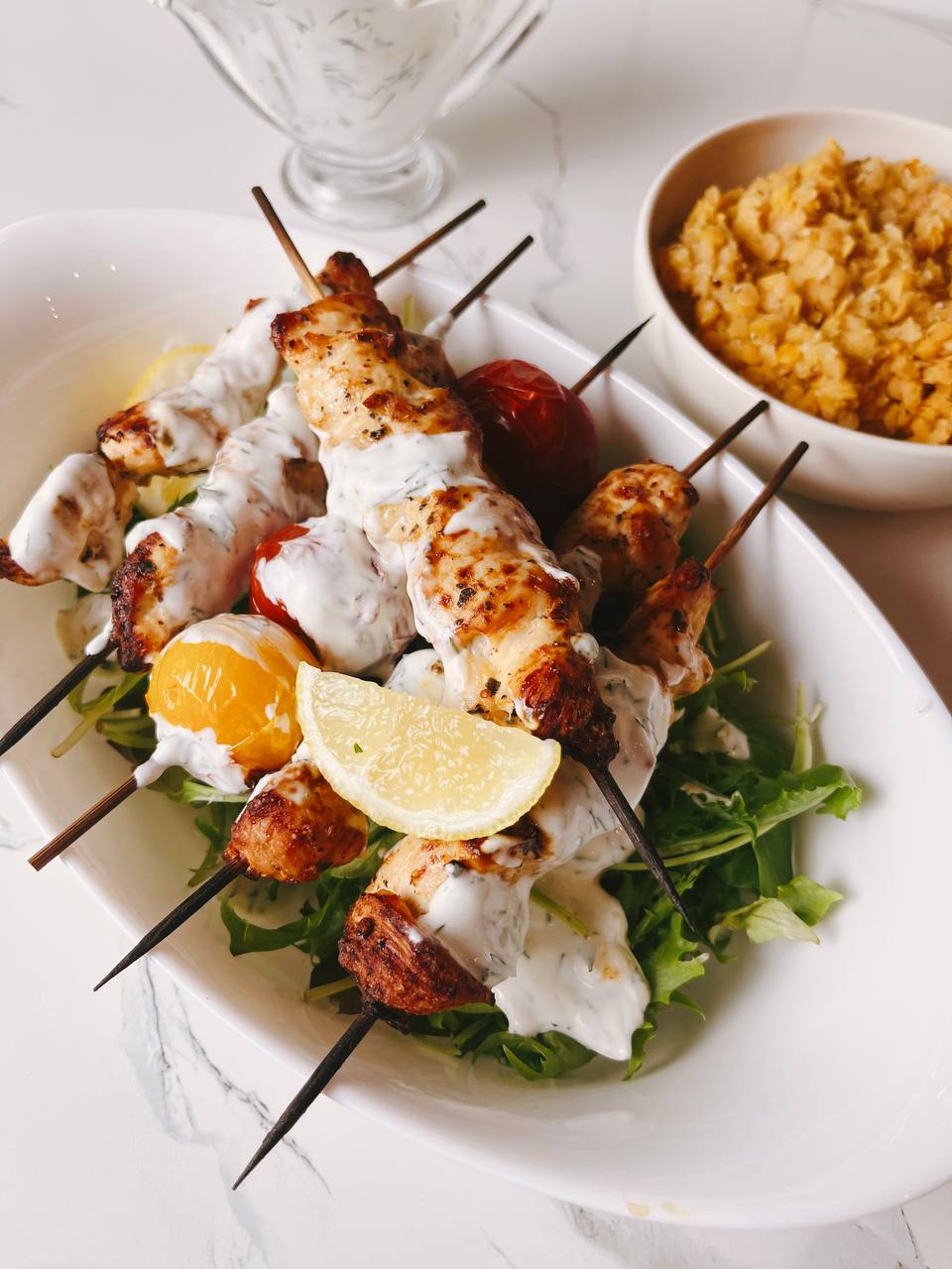 Juicy lemon and herb chicken skewers, golden brown and perfectly grilled, ready to serve