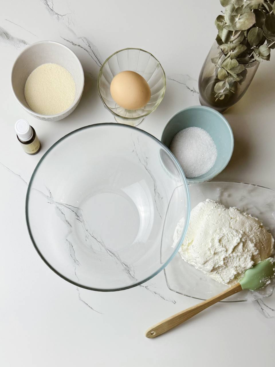 Ingredients for baked cottage cheese pancakes on a kitchen counter