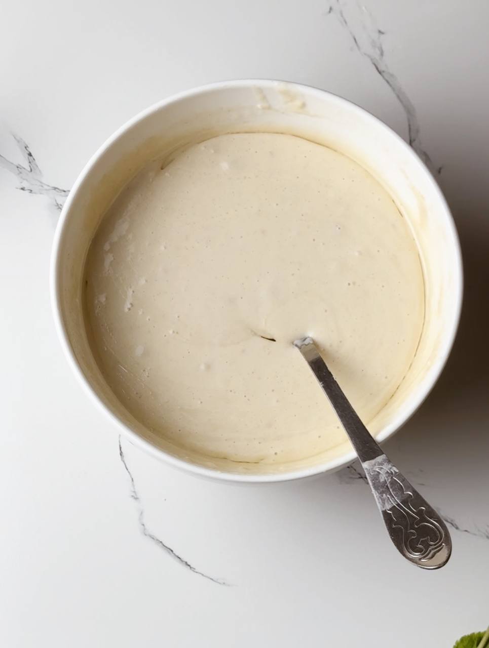 Smooth pancake batter in a mixing bowl, ready for cooking.