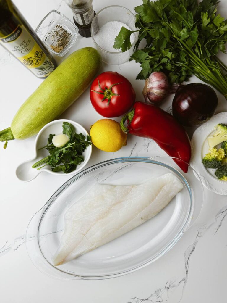 Ingredients for baked cod with vegetables and garlic-lemon oil