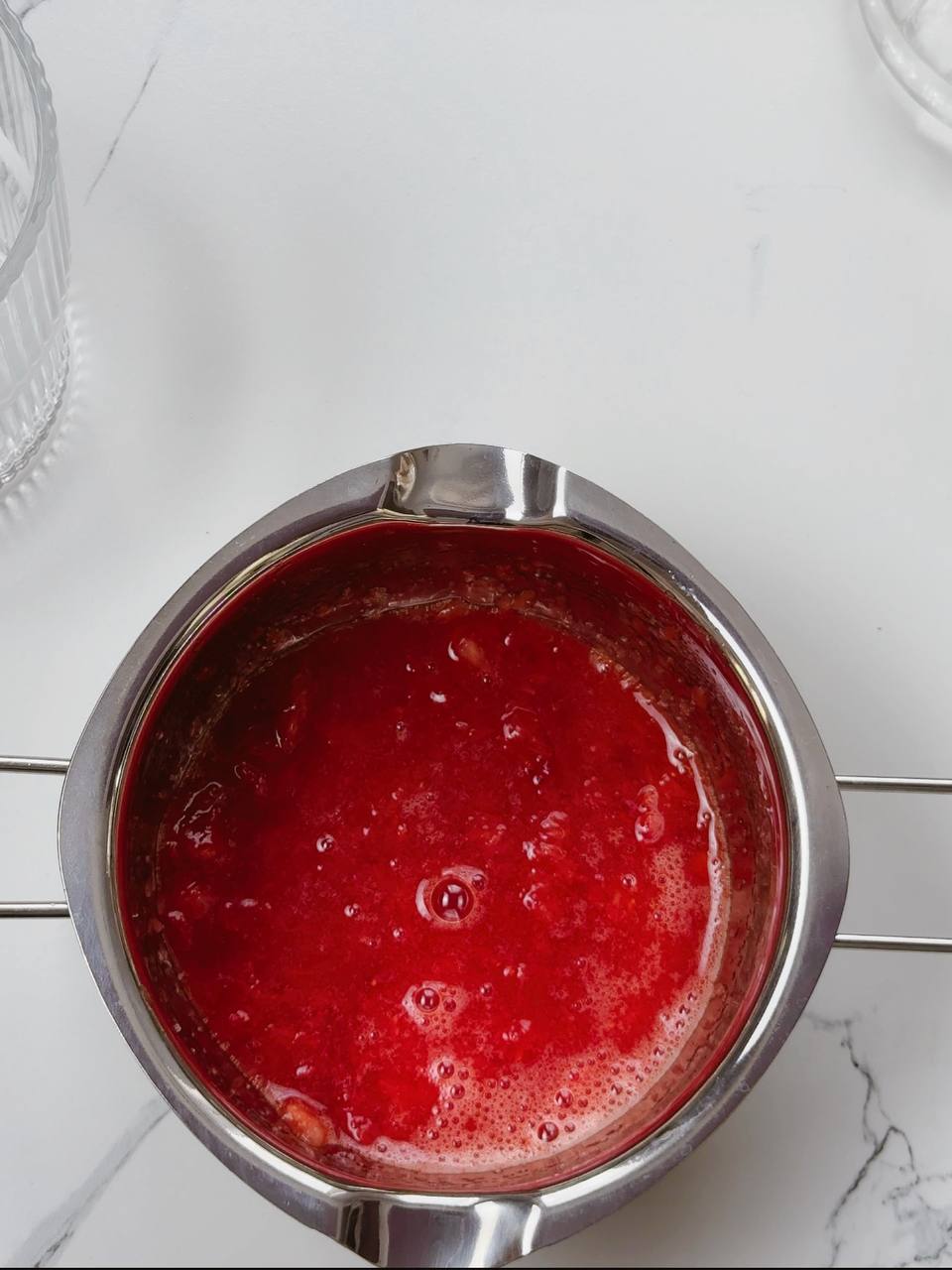 Freshly cut strawberries sprinkled with sugar in a bowl