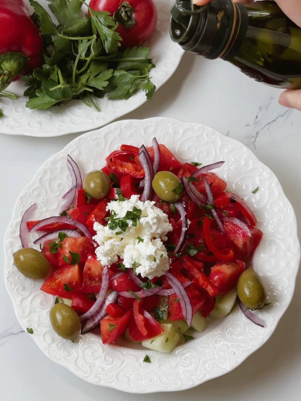 Shopski Salad served in a bowl before adding olive oil