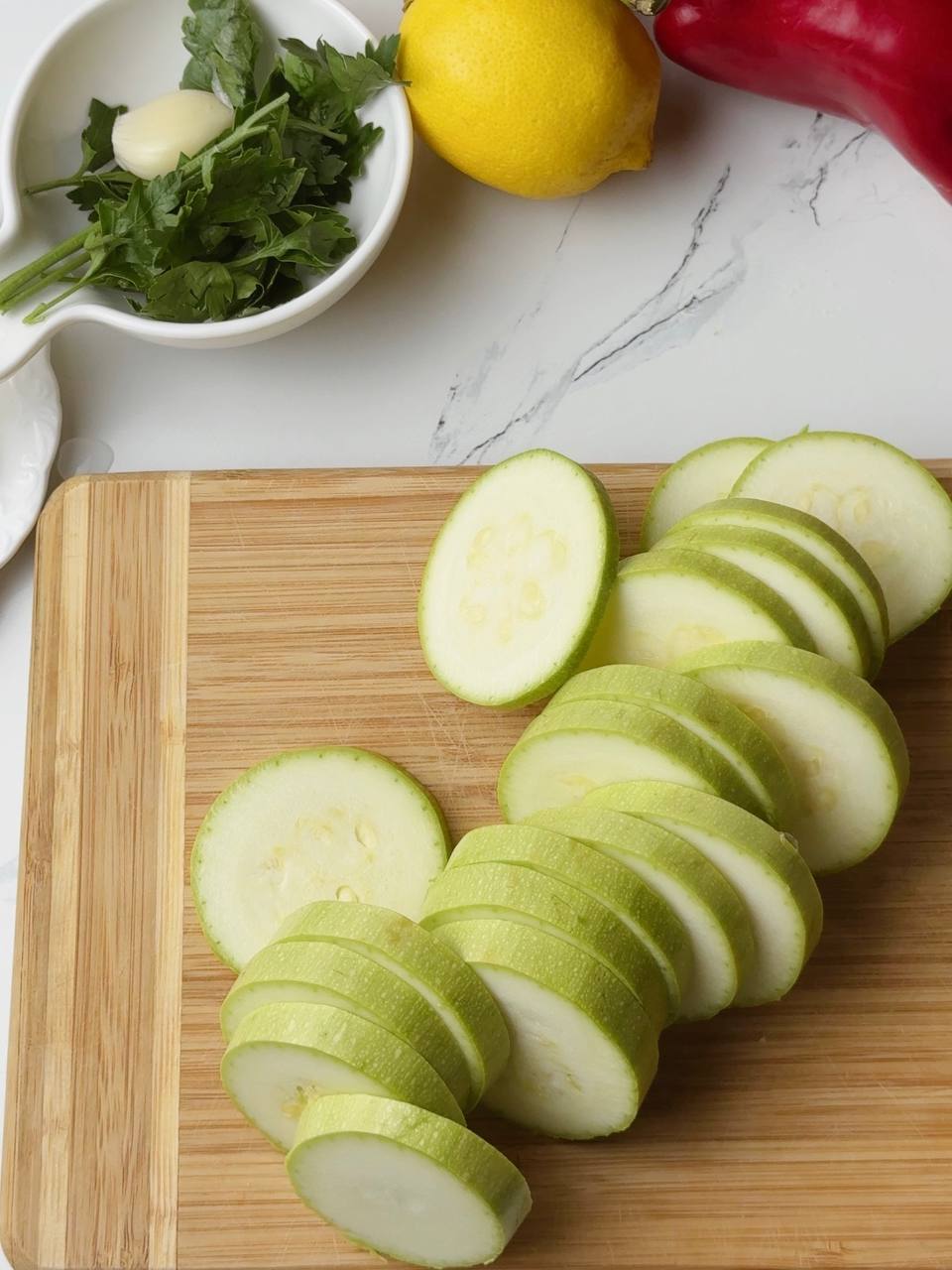 Zucchini sliced into thick round disks for baking