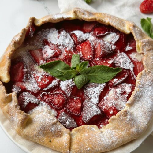 Closeup of baked strawberry galette with golden crust
