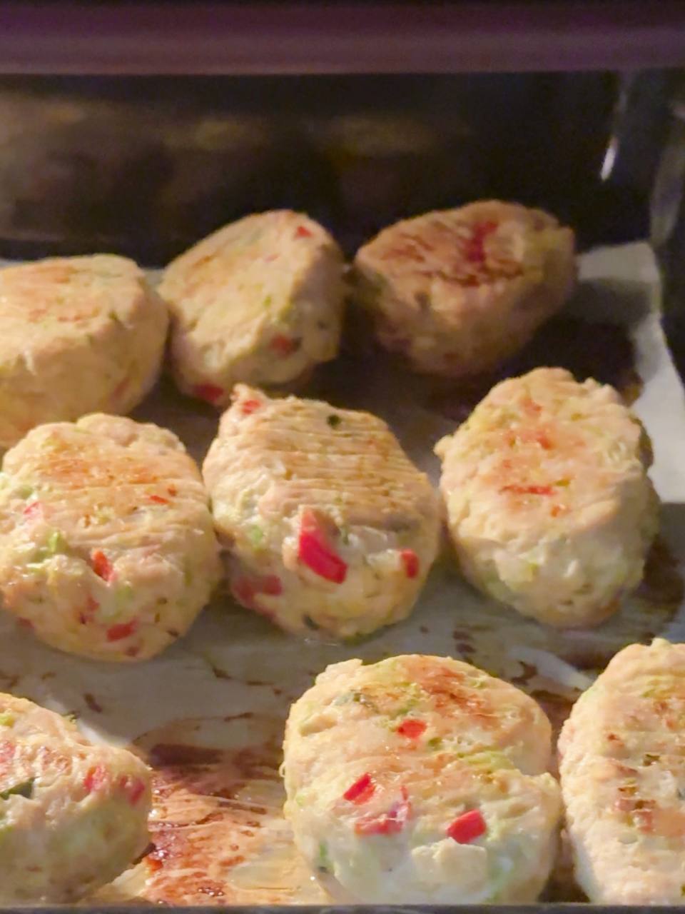 Partially baked fritters turned halfway through cooking