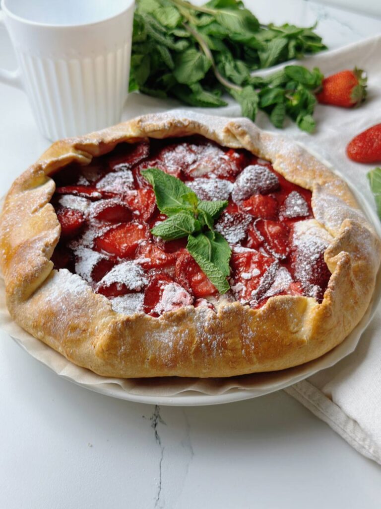 Cottage cheese galette with strawberries and fresh mint for garnish