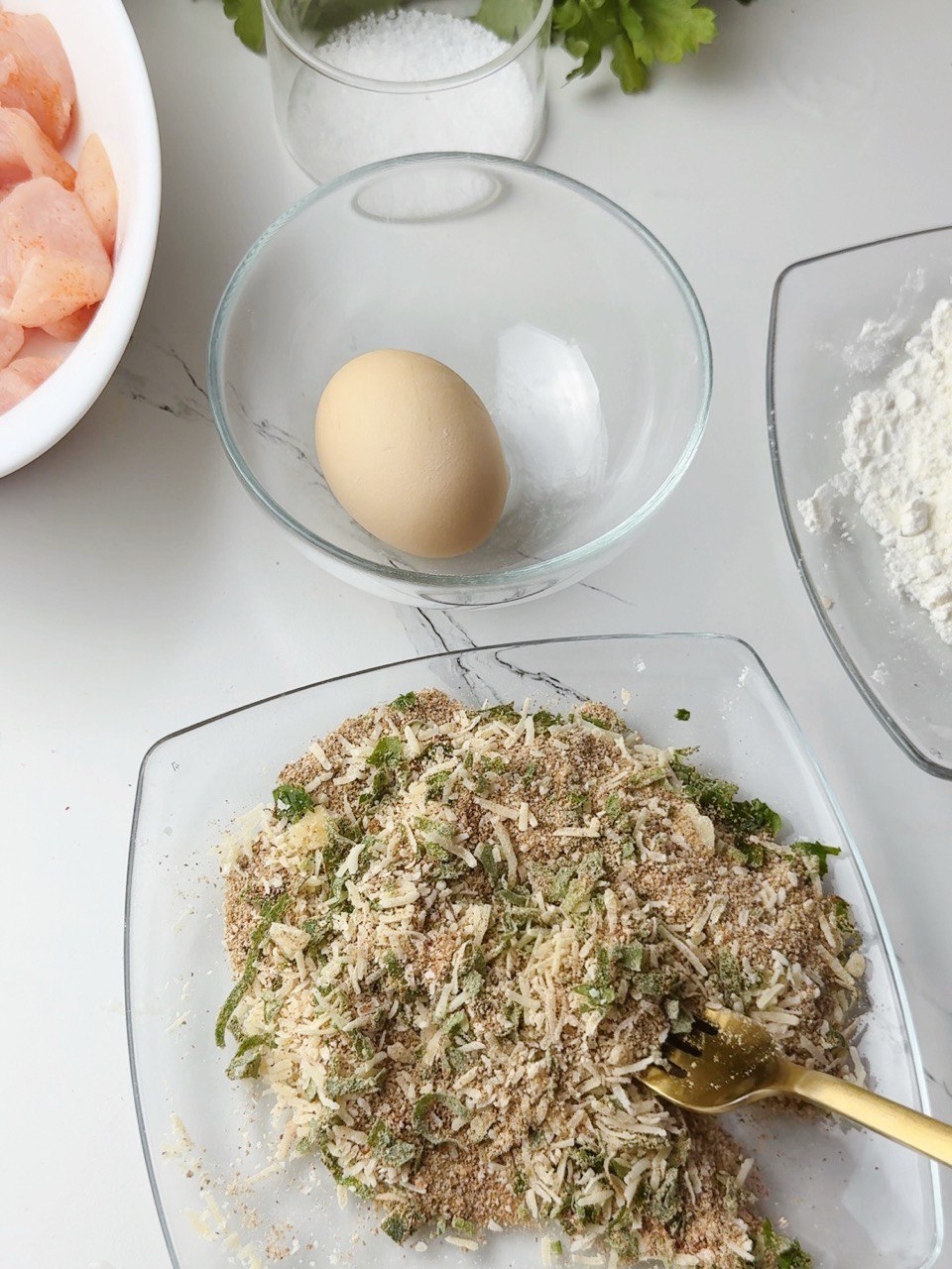 Breadcrumbs, Parmesan, paprika, and parsley mixture for coating