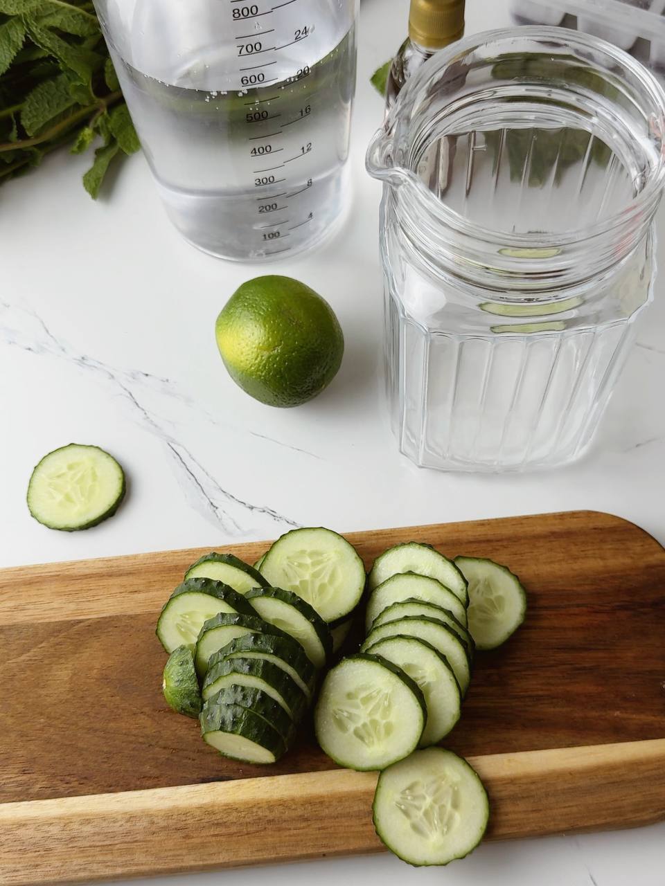 Slicing fresh cucumber on a cutting board