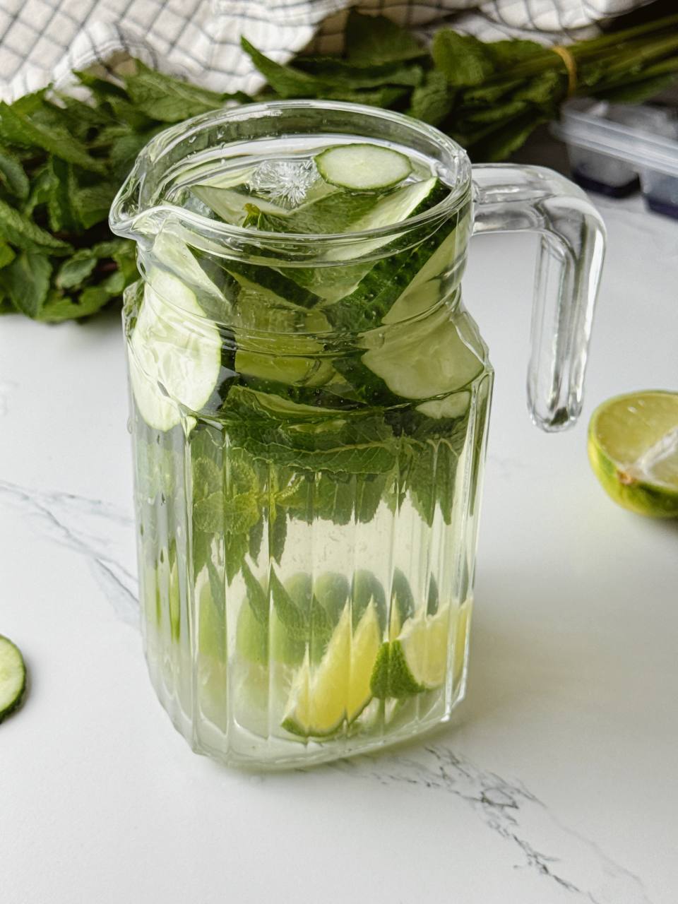 Refreshing cucumber lime water served with mint and ice