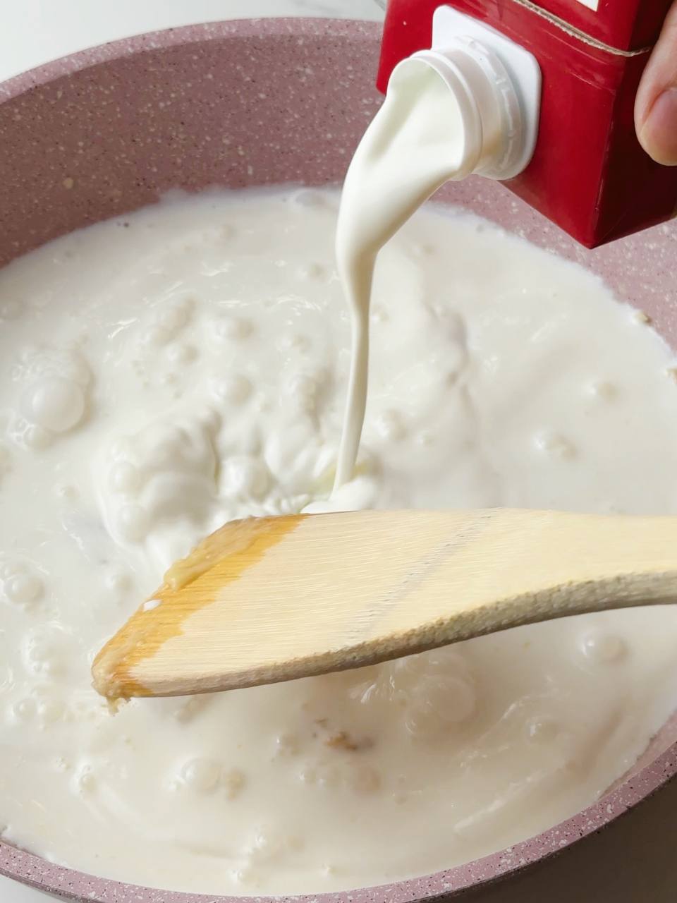Cream added to the butter and flour mixture in a saucepan.
