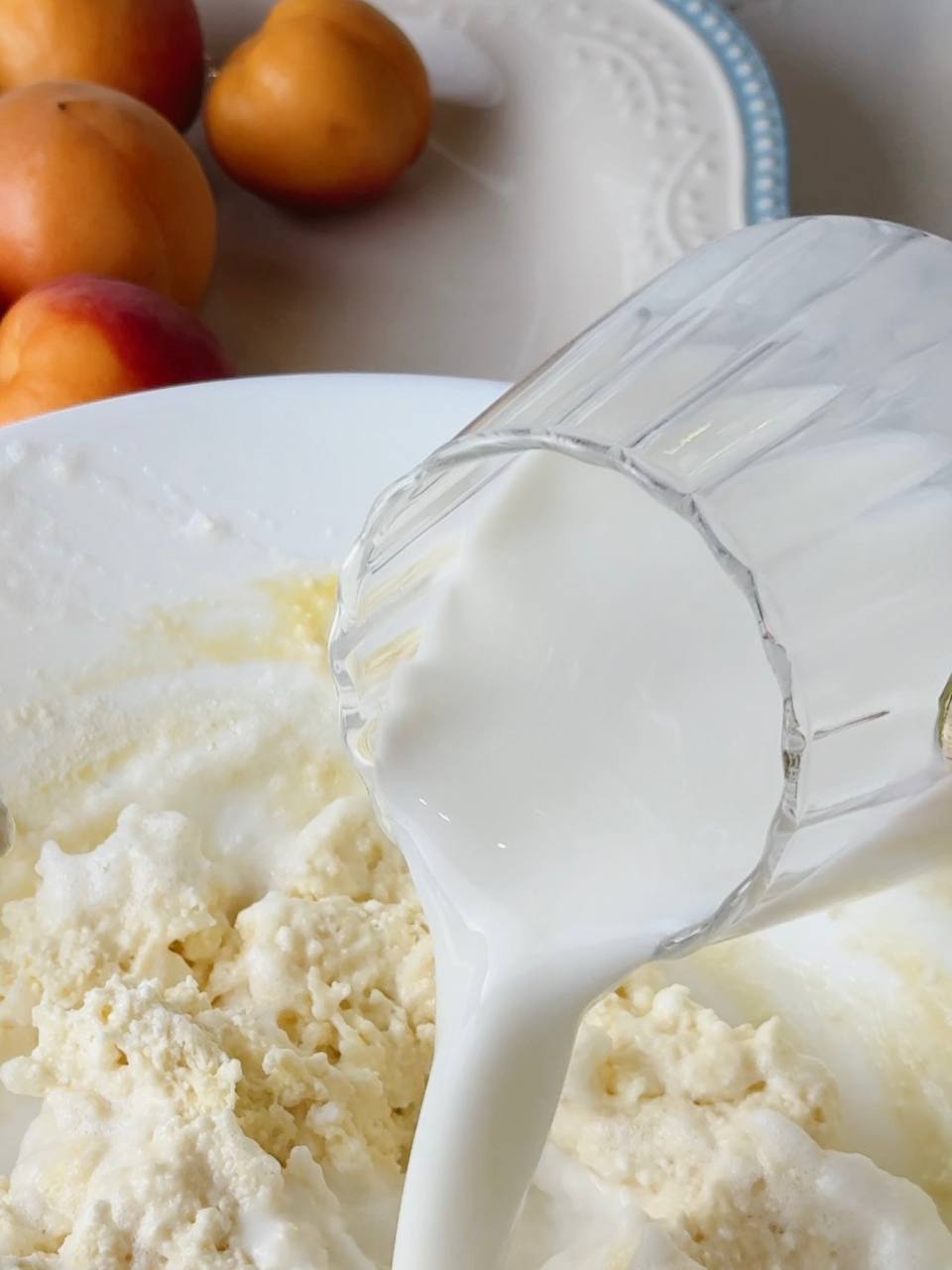 Milk being added to the cottage cheese pancake batter.