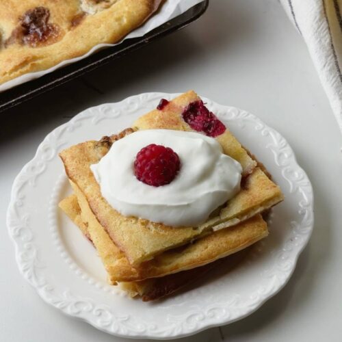 Baked banana pancake served with Greek yogurt and berries