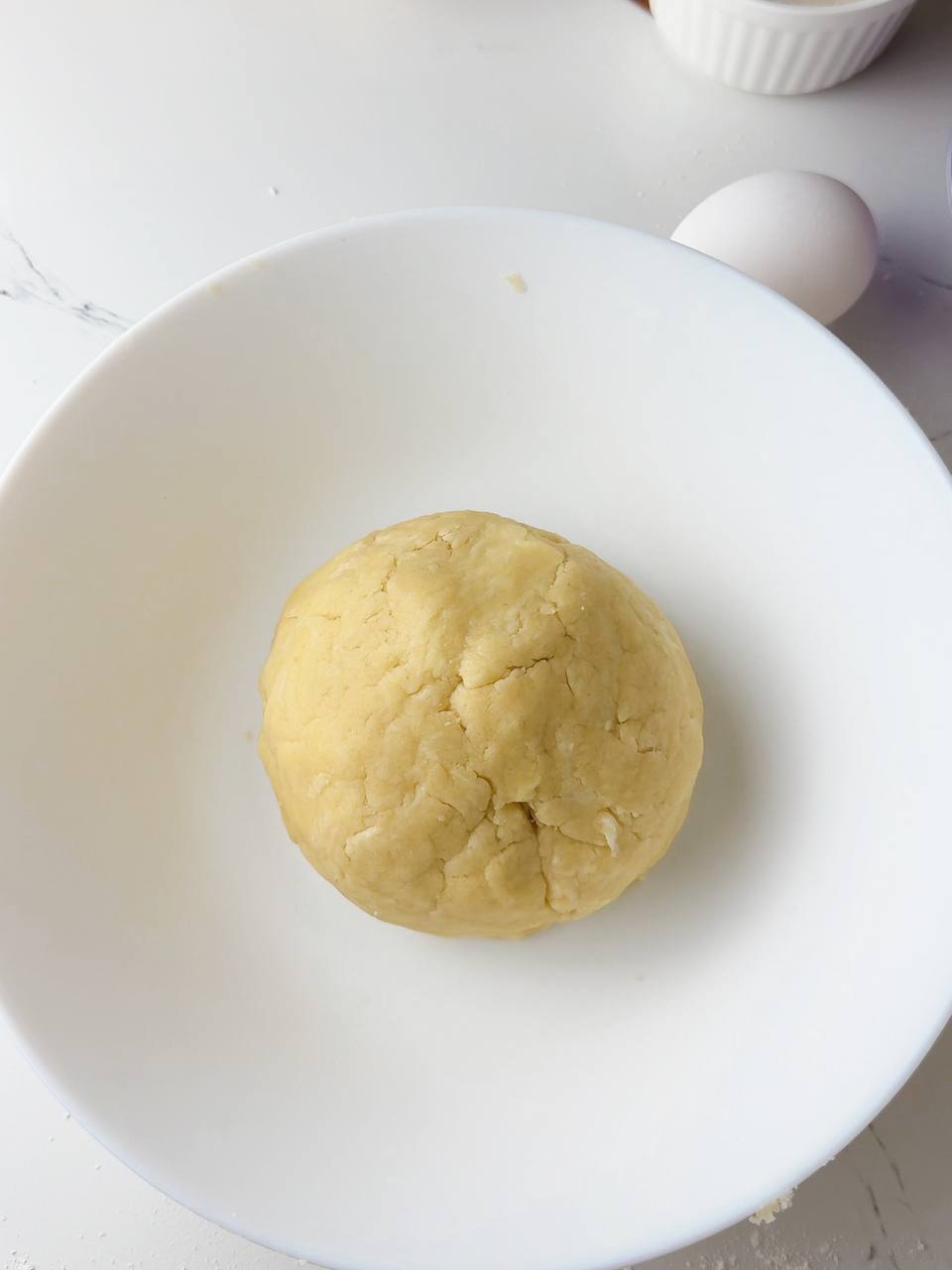 Ball of pie dough ready to rest in the fridge