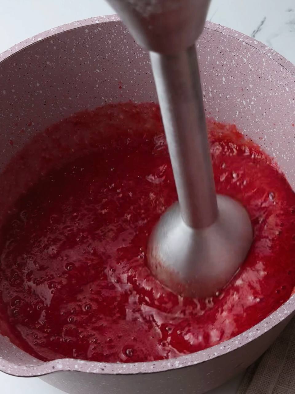 Making simple strawberry compote from frozen berries