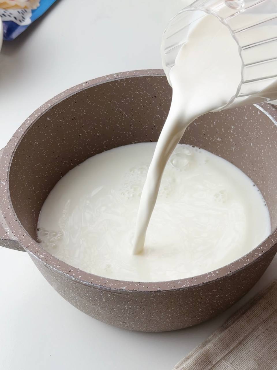 Mixing milk and cream for homemade custard