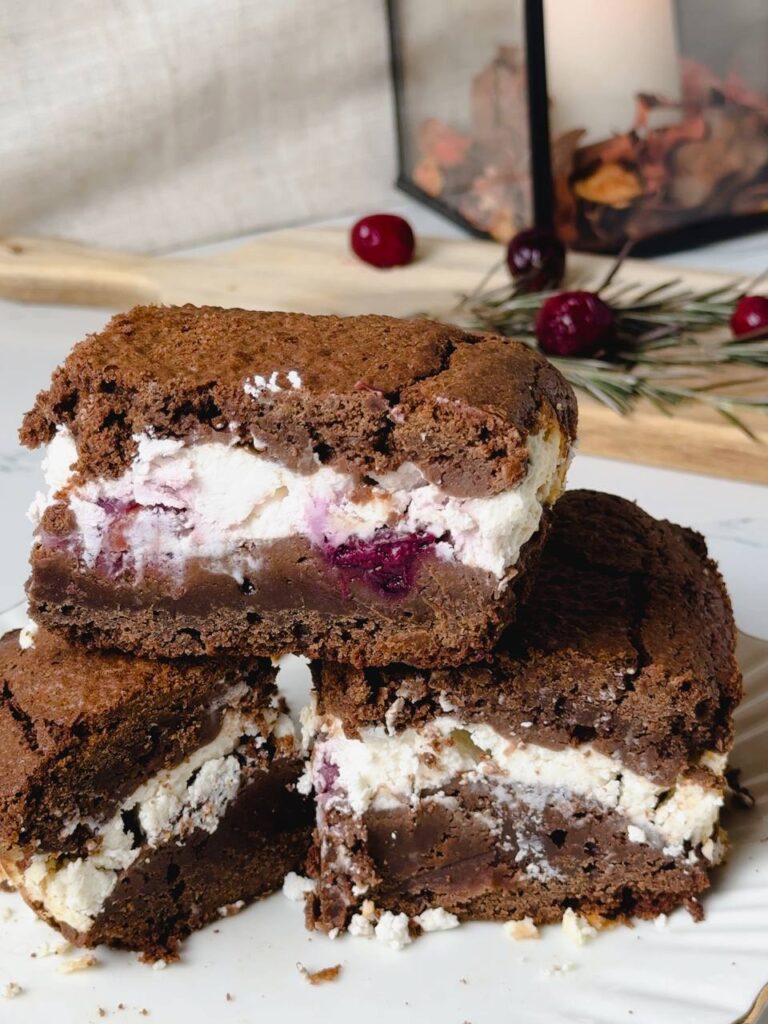 Chilled and sliced chocolate cream cheese cherry brownies served
