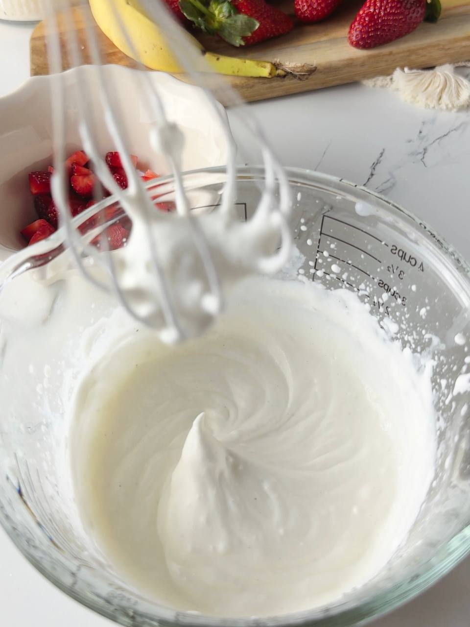 Whipping cream and cream cheese to make smooth filling