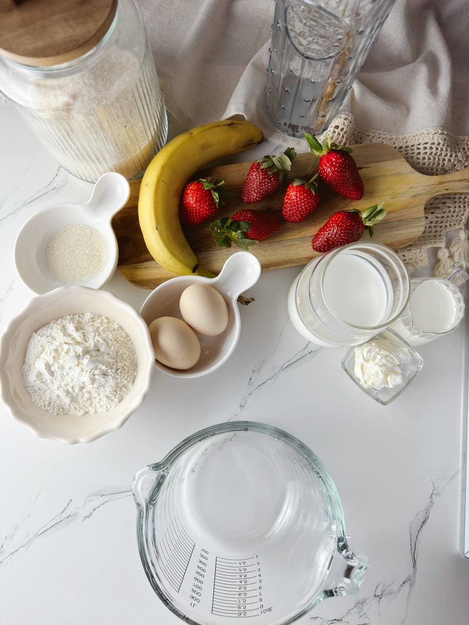 Ingredients for strawberry cream oven baked pancake roll with fresh strawberries and cream
