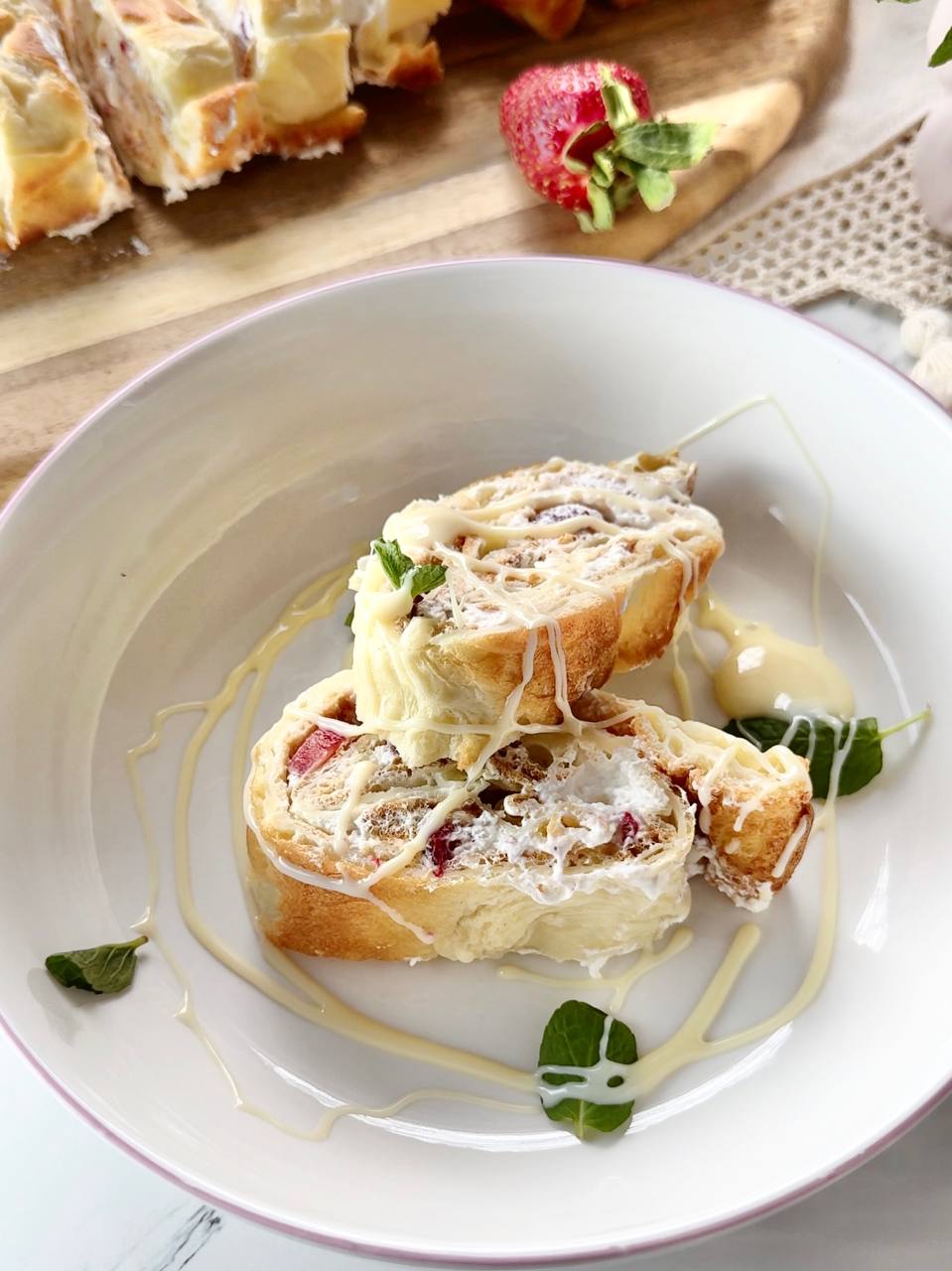 Served strawberry cream oven baked pancake roll with powdered sugar