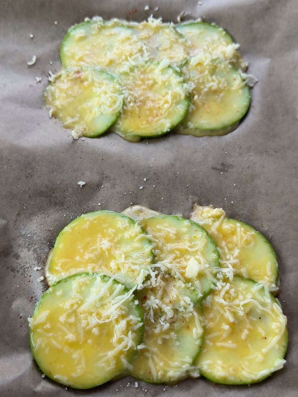 adding extra grated cheese on top of zucchini layers before baking