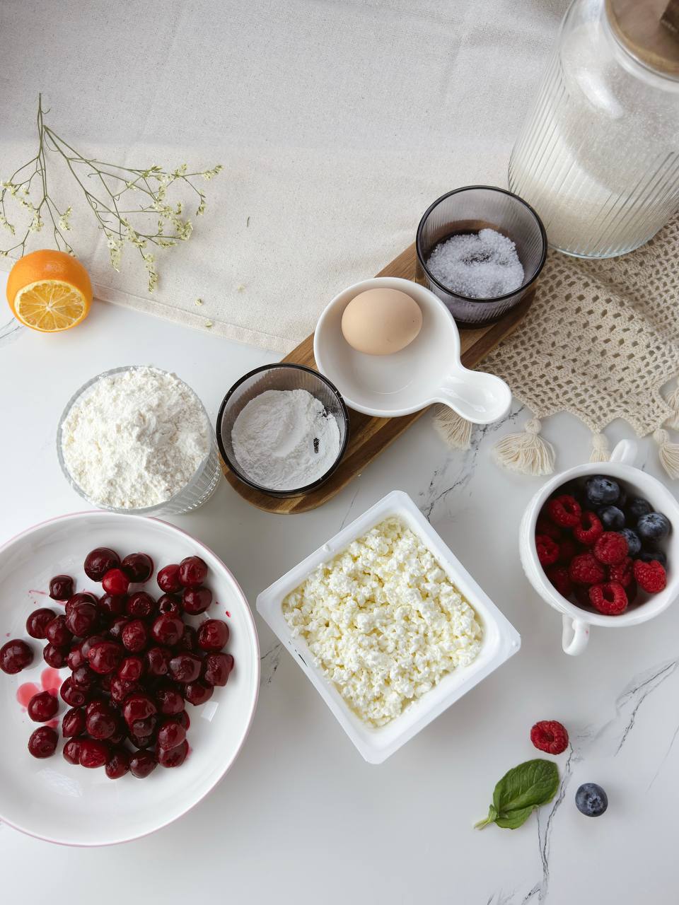 Ingredients for cherry cottage cheese galettes with frozen cherries and simple dough