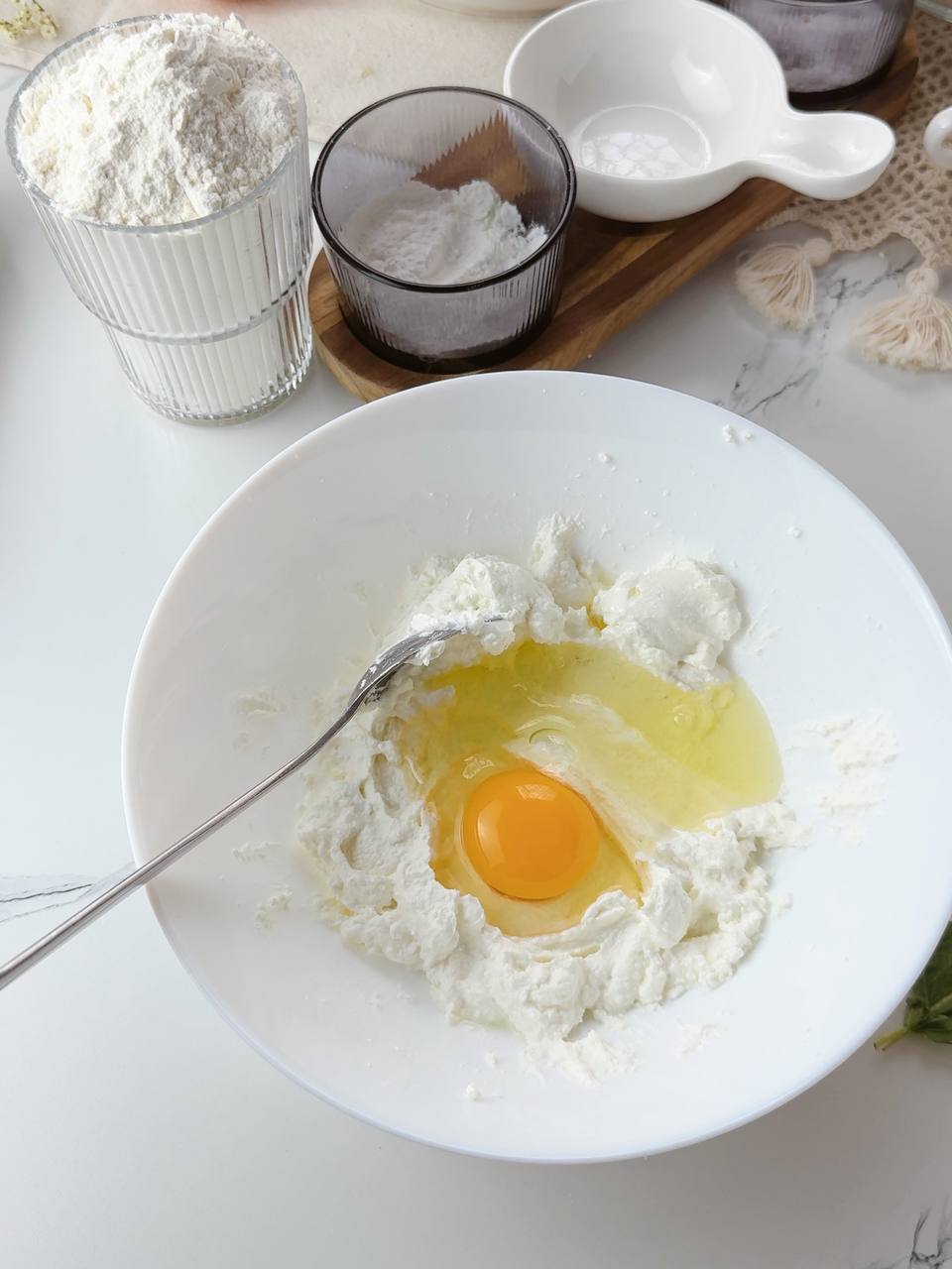 Cottage cheese and egg mixed in a bowl for galette dough