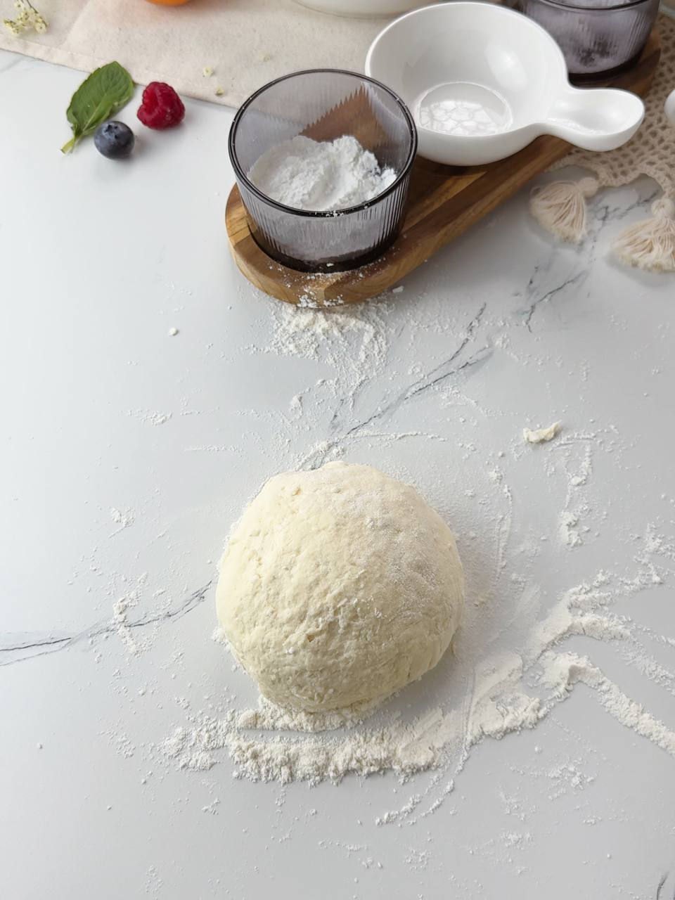 Soft cottage cheese dough formed into a ball ready to rest