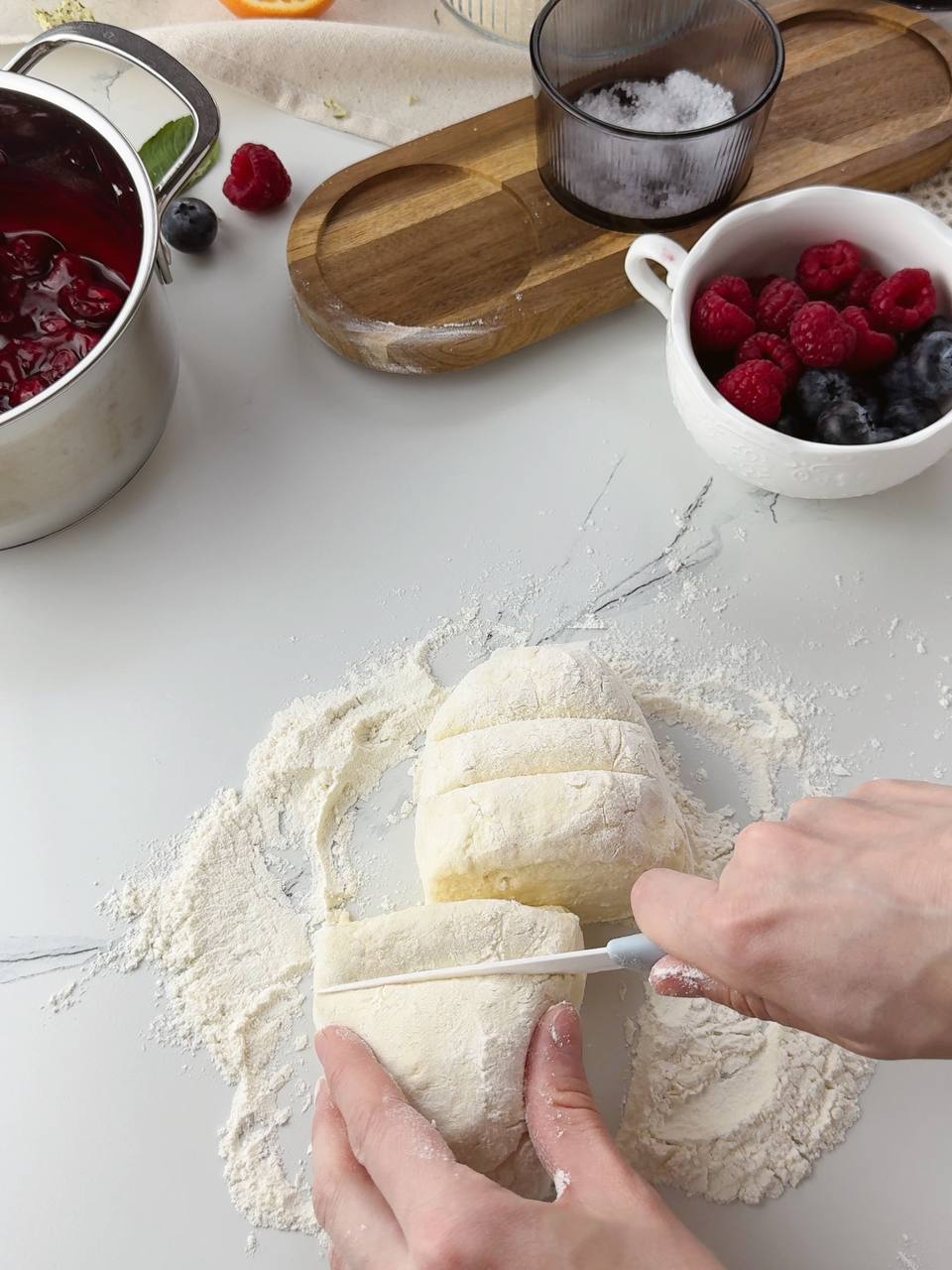 Dividing cottage cheese dough into equal portions for galettes