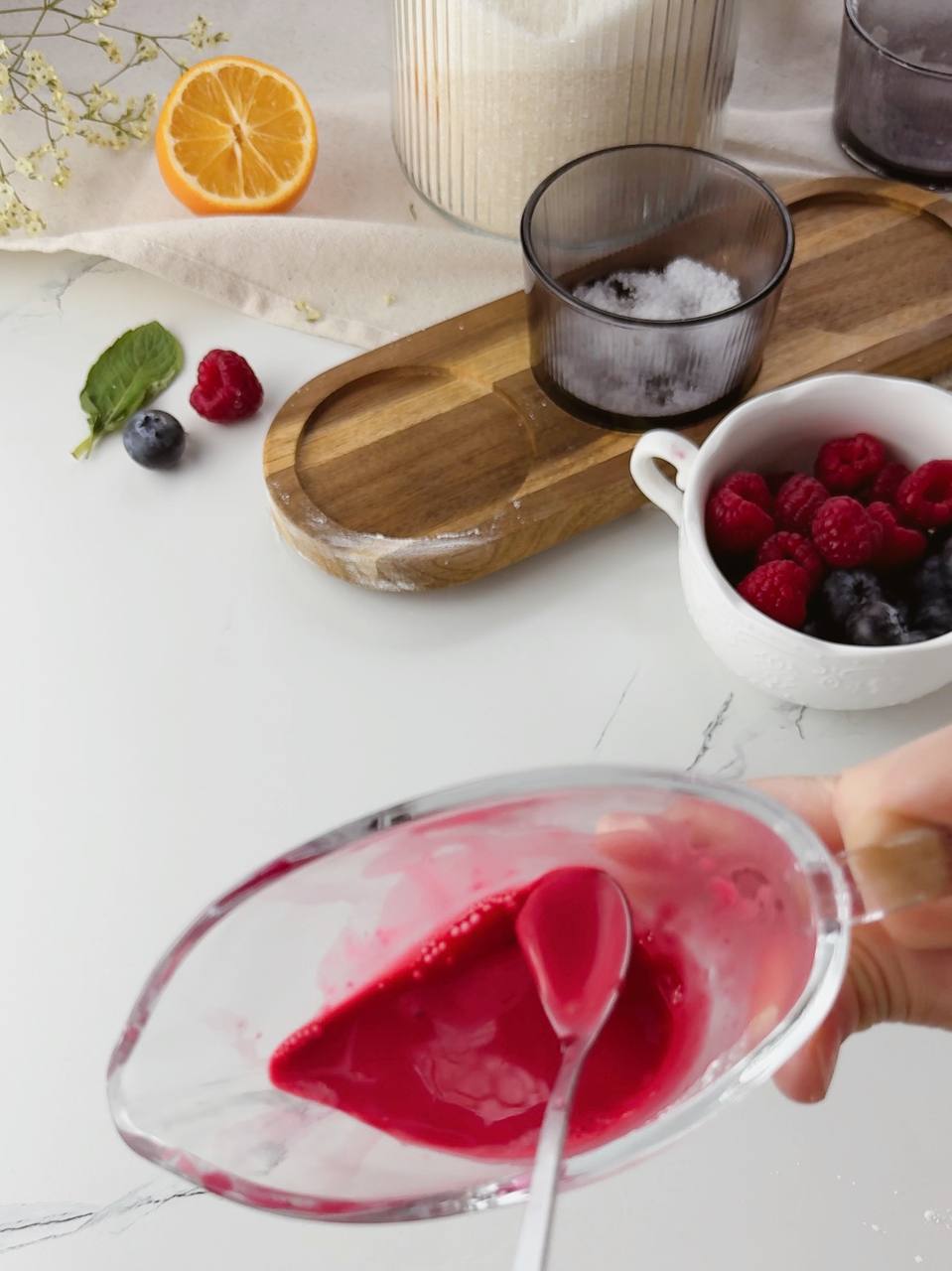 Mixing cornstarch with cherry juice to thicken the filling