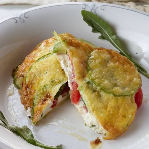 close up of sliced zucchini breakfast sandwich with creamy filling