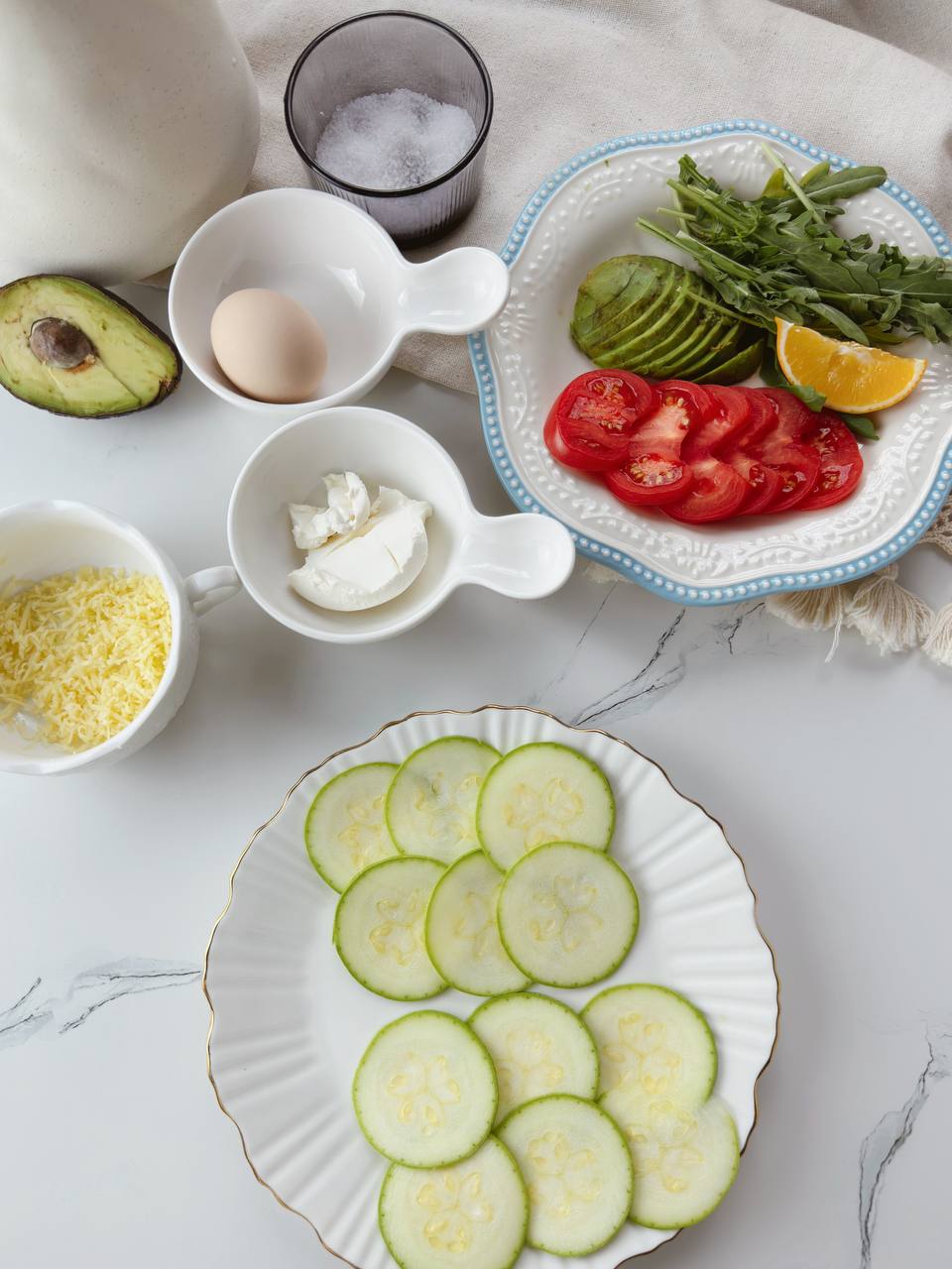 ingredients for healthy baked zucchini breakfast sandwich with avocado and cream cheese