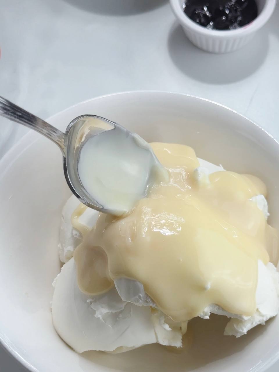 adding condensed milk to cream cheese for the filling