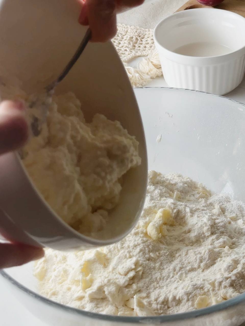 adding the cottage cheese mixture to the flour mixture