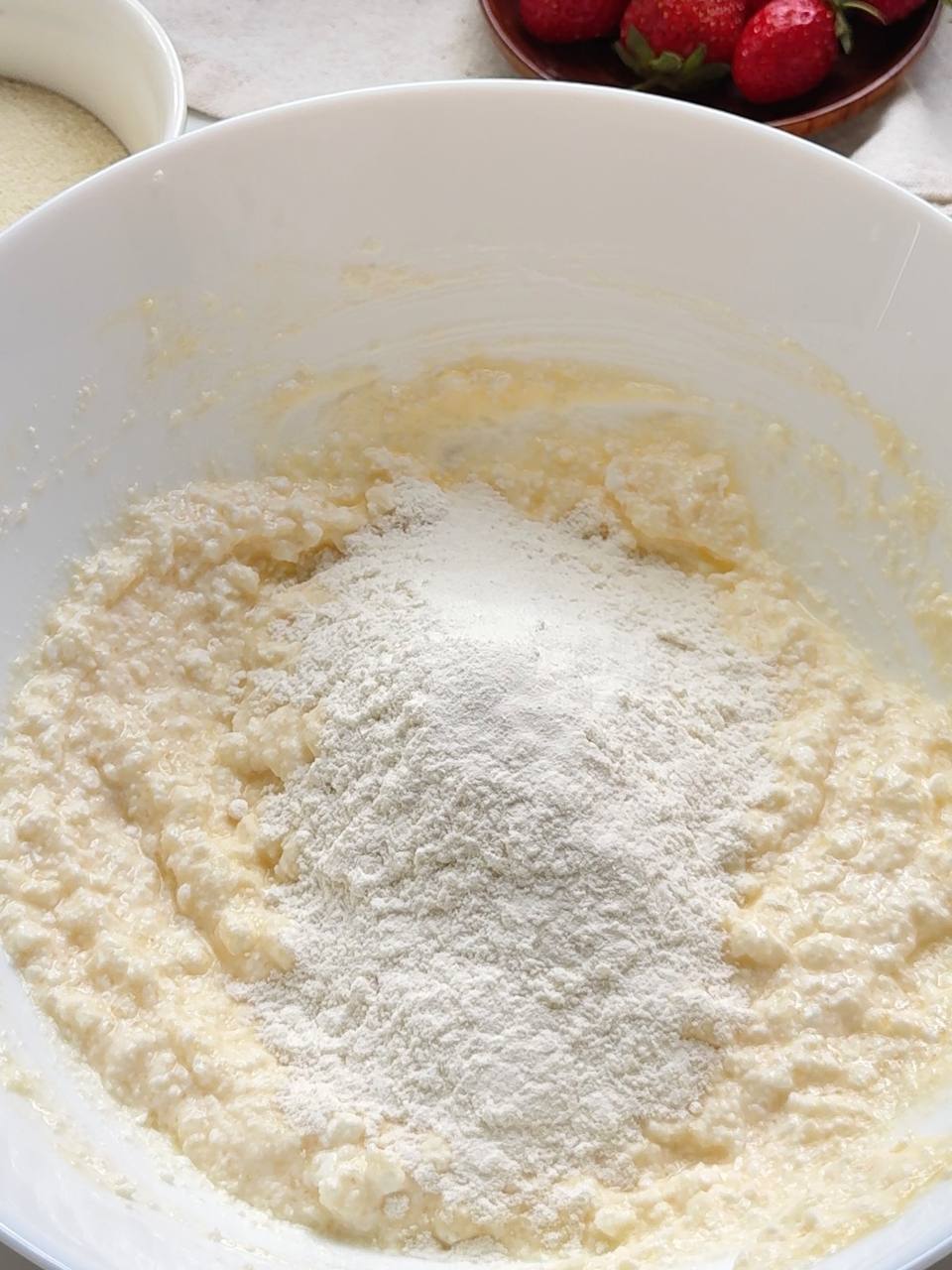 adding flour to the cottage cheese donut dough