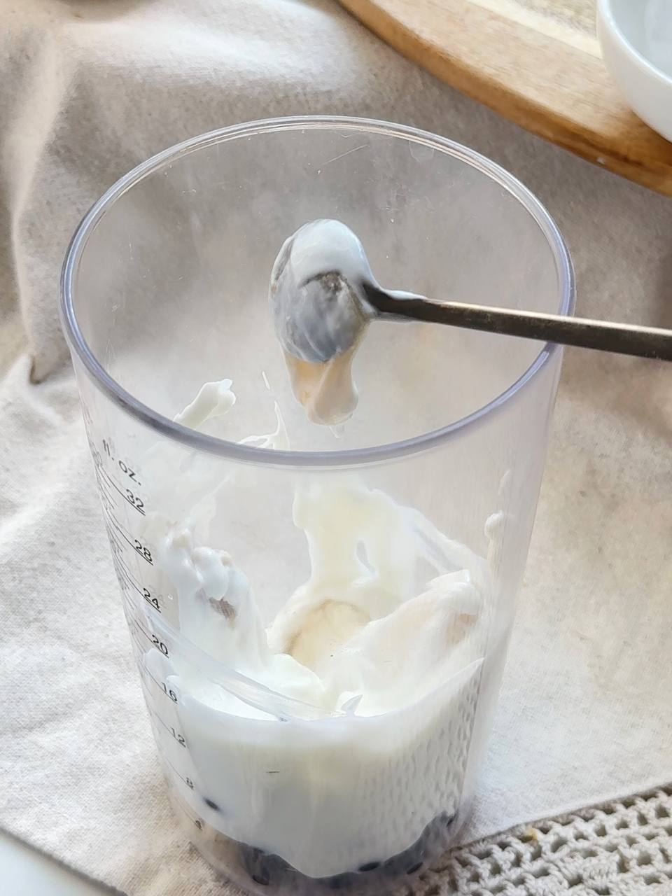 adding Greek yogurt to the blackcurrant smoothie