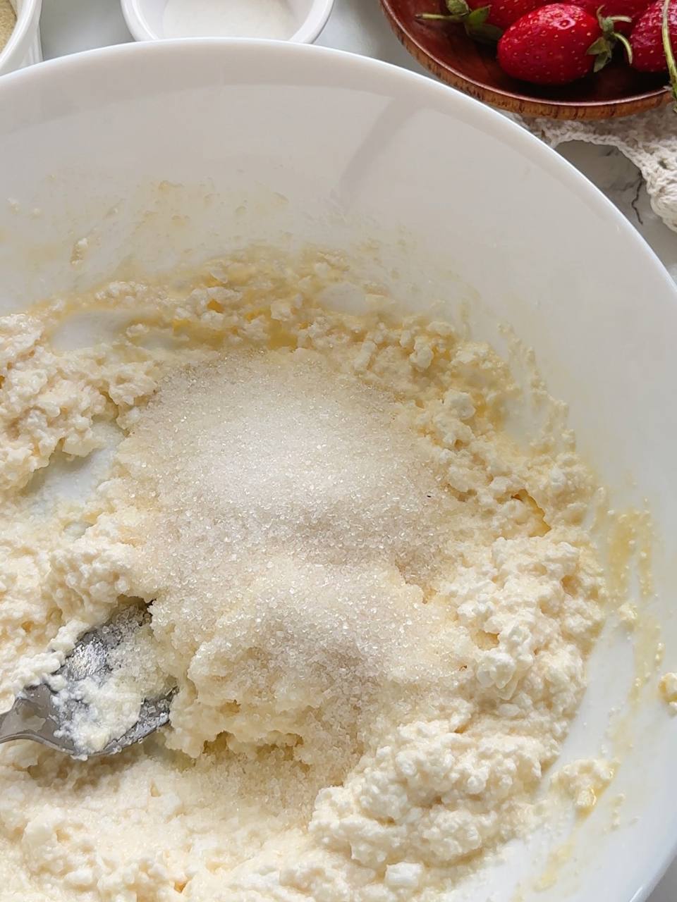 adding sugar to the cottage cheese mixture
