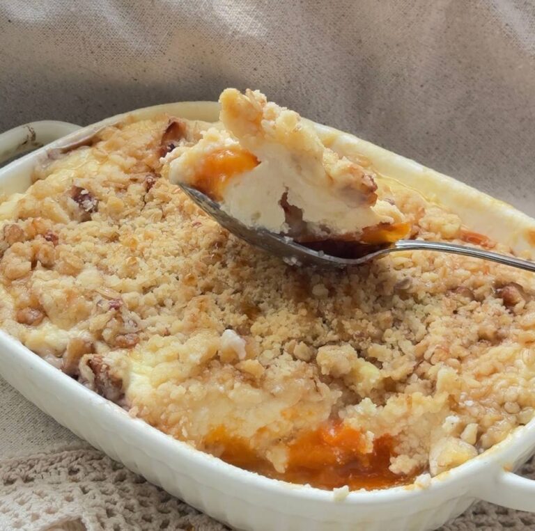 Baked apricot cottage cheese crumble served warm with a spoon