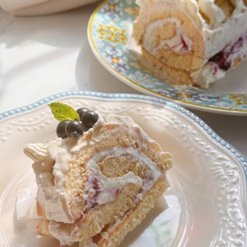 slice of berry roll cake with cottage cheese cream filling