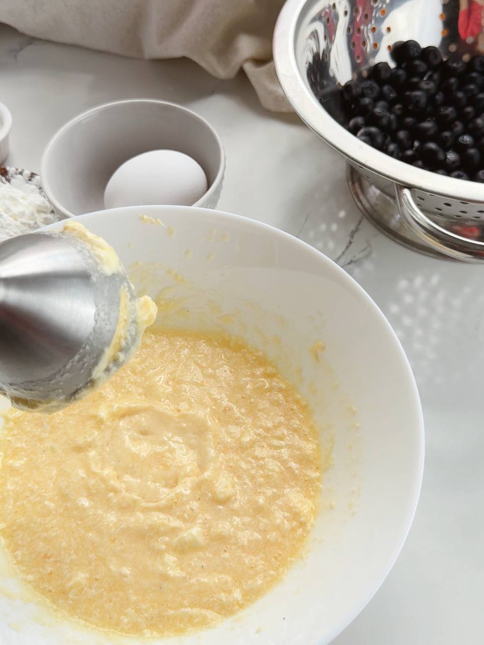 blending butter with eggs and sugar for the pie crust