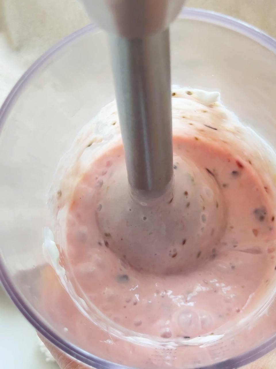 blending the smoothie with a hand blender