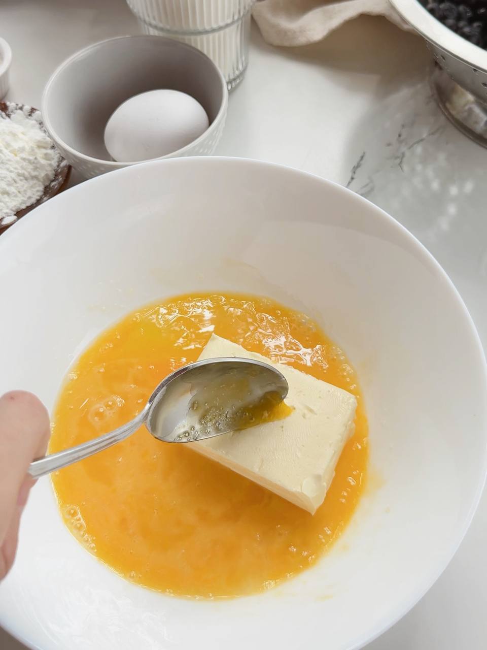 butter added to the egg and sugar mixture
