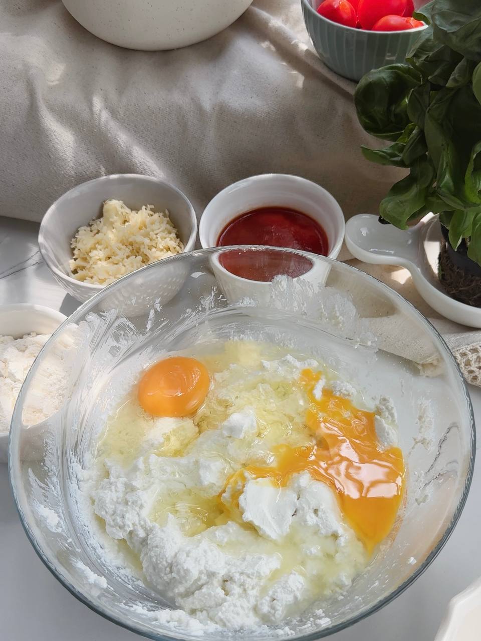 mixing cottage cheese and eggs for mini pizza dough