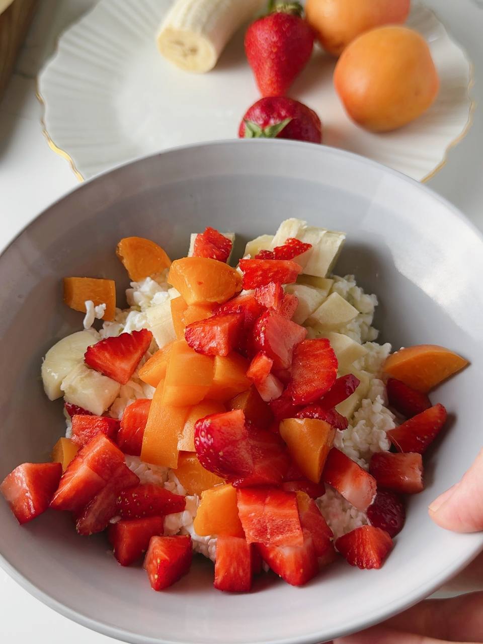 mixing diced fruit into cottage cheese filling