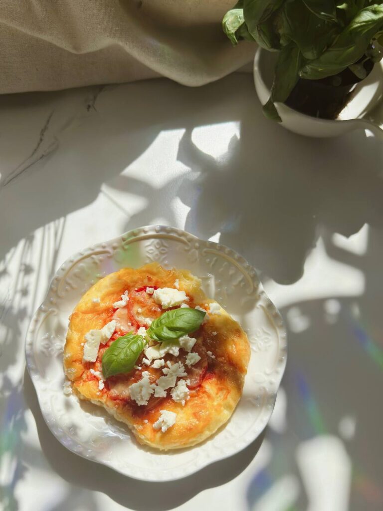 high-protein cottage cheese mini pizzas topped with feta and fresh basil