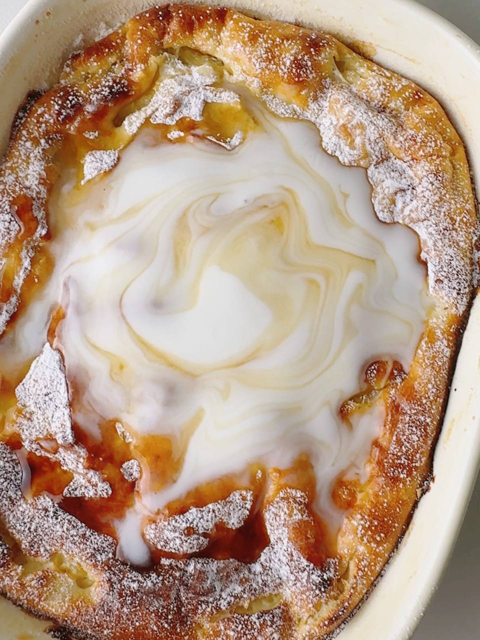 apple cottage cheese oatmeal bake topped with Greek yogurt and maple syrup