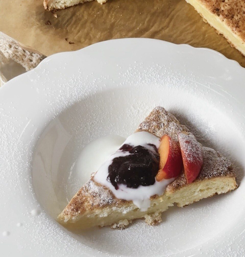 cottage cheese scones served with Greek yogurt, blackcurrant jam, and apricots