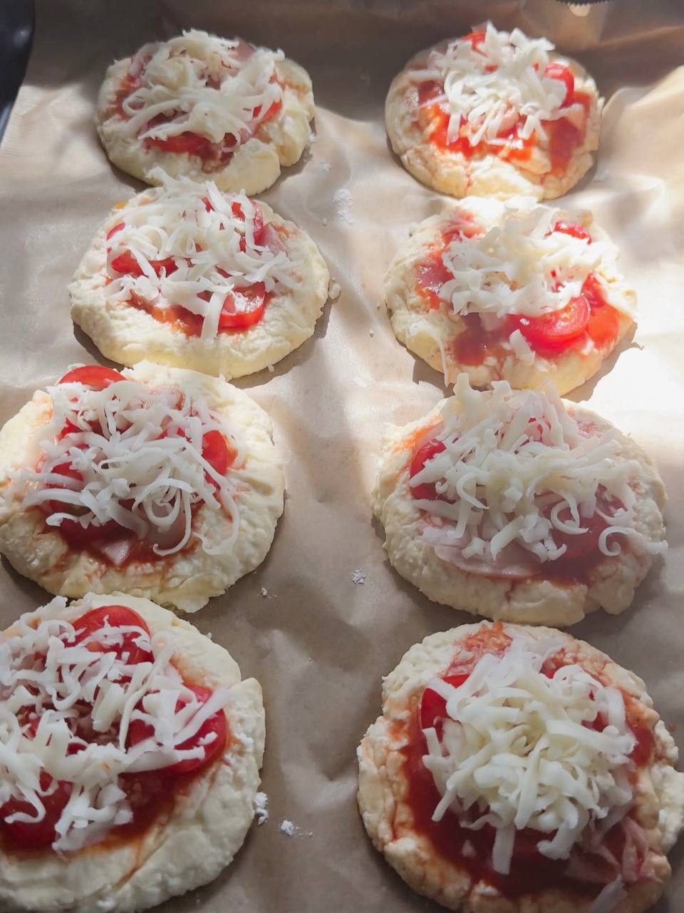 cottage cheese mini pizzas topped with turkey, cherry tomatoes, and mozzarella