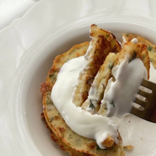 gluten-free cottage cheese fritters served with Greek yogurt and lemon