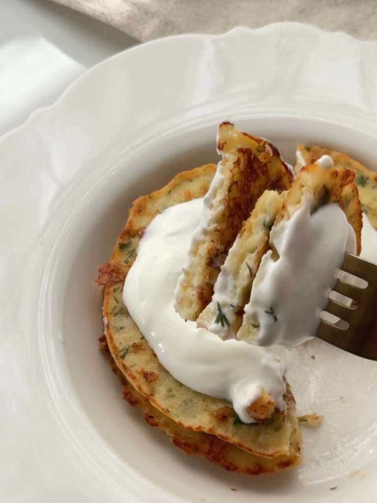 gluten-free cottage cheese fritters served with Greek yogurt and lemon