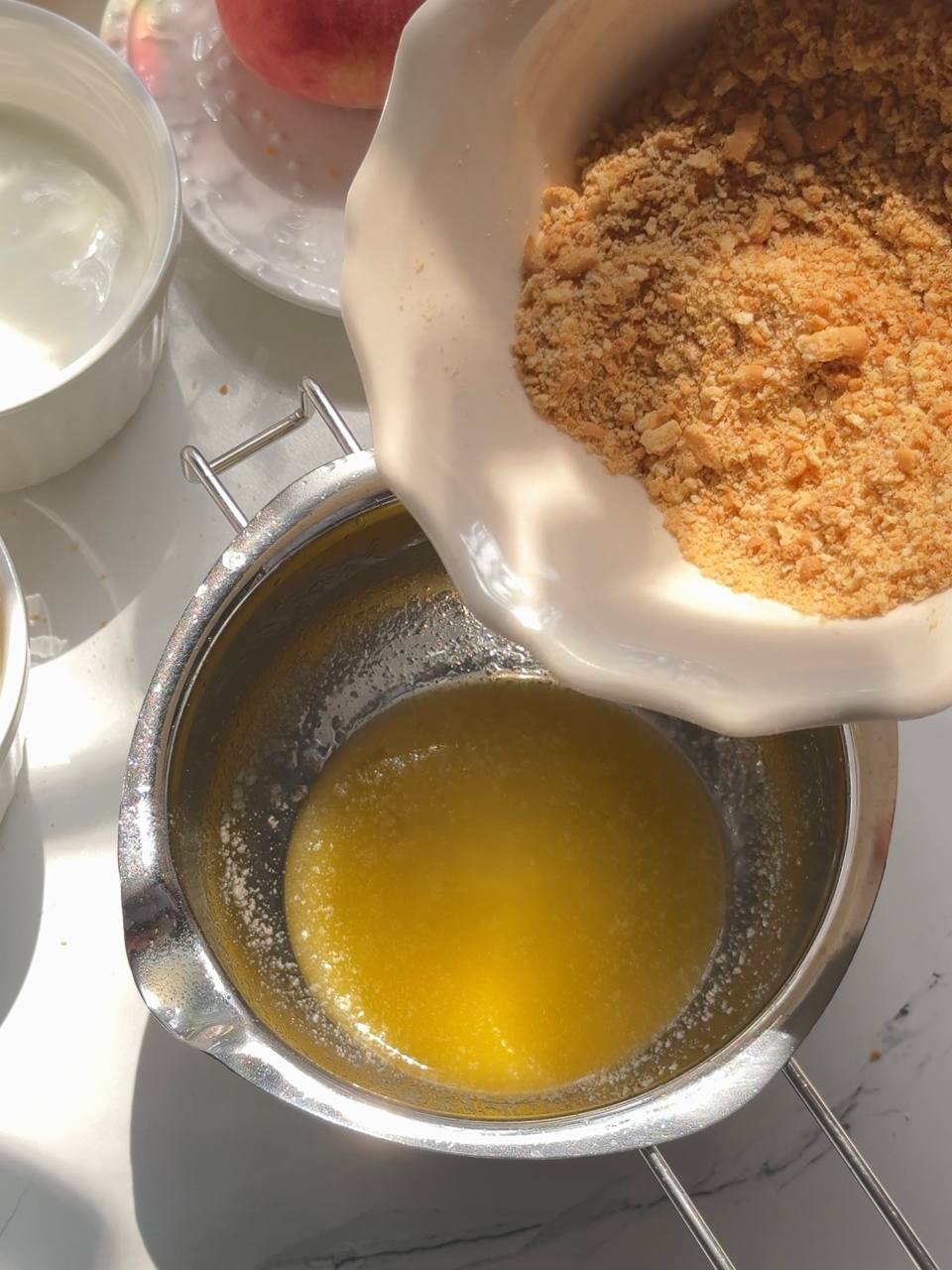 mixing cookie crumbs with melted butter